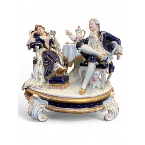 578 - A large Royal Dux porcelain figure group of a Lady in a sedan chair. Height 40cm together with a lar... 