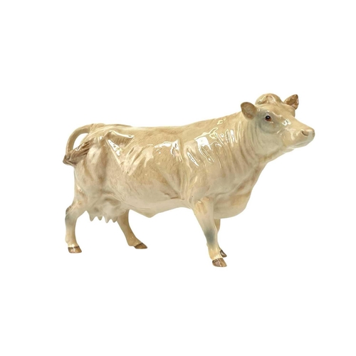 588 - A Beswick Pottery Fresian cow CH Leegwater. Together with Jersey cow CH Newton Tinkle, Charolais cow... 