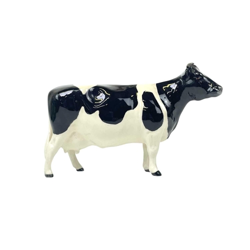 588 - A Beswick Pottery Fresian cow CH Leegwater. Together with Jersey cow CH Newton Tinkle, Charolais cow... 