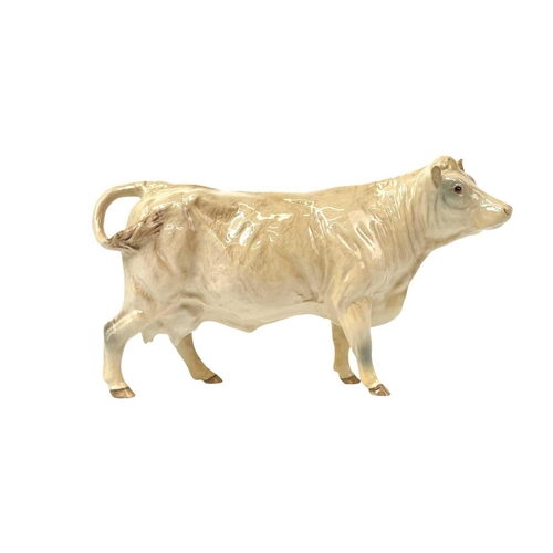 588 - A Beswick Pottery Fresian cow CH Leegwater. Together with Jersey cow CH Newton Tinkle, Charolais cow... 