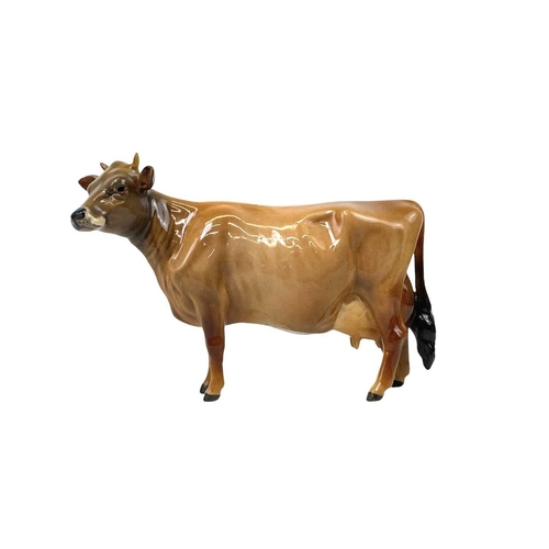 588 - A Beswick Pottery Fresian cow CH Leegwater. Together with Jersey cow CH Newton Tinkle, Charolais cow... 