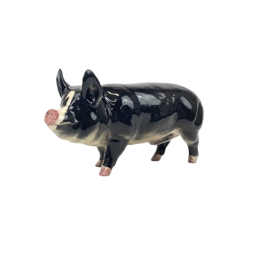 589 - A Beswick Pottery Berkshire boar. In gloss together with a Beswick Pottery Blackface ewe, lamb and a... 