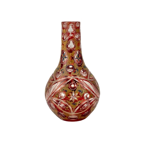 599 - A 19th century Bohemian ruby flash glass vase Highlighted with overpaint height 24cm. The rim has be... 