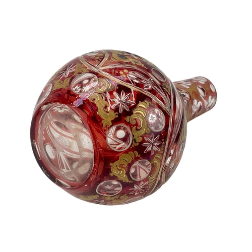 599 - A 19th century Bohemian ruby flash glass vase Highlighted with overpaint height 24cm. The rim has be... 