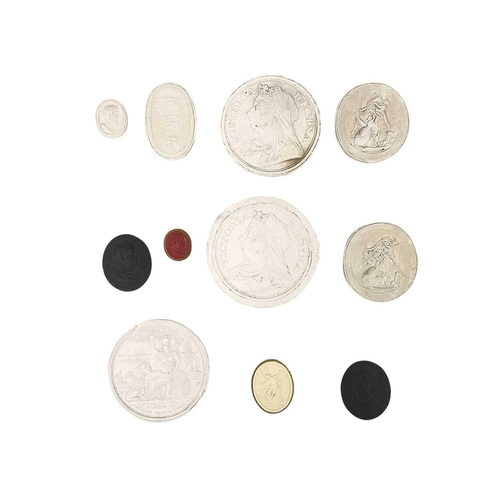 60 - A collection of twelve intaglios. In plaster and pottery, including one framed 19th century and late... 