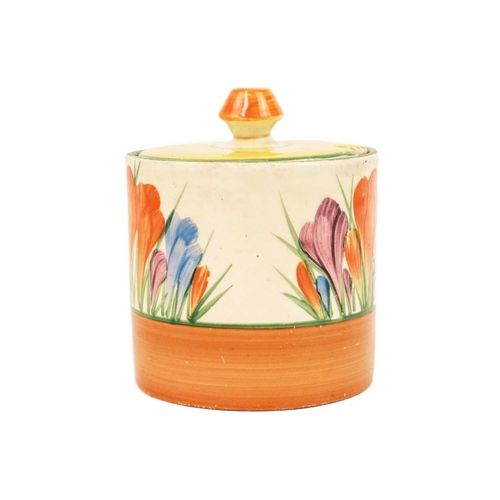 605 - A Clarice Cliff Crocus pattern drum preserve pot and cover. Bizarre Newport Pottery marks, height 9c... 