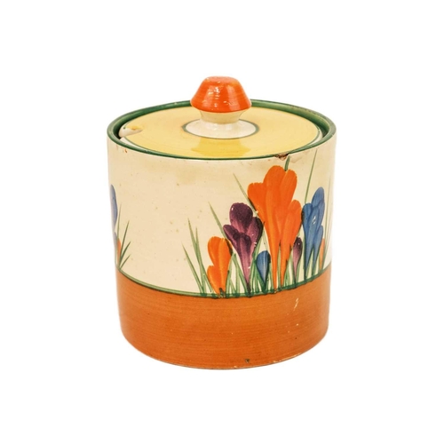 608 - A Clarice Cliff Crocus pattern drum shape preserve pot and cover. Bizarre Newport Pottery marks, hei... 