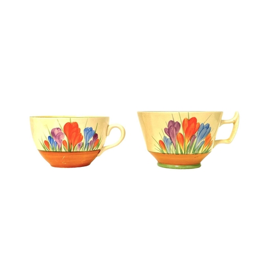 610 - Clarice Cliff Crocus pattern. Comprising: two teacups, two breakfast cups, a mug, an egg cup, four s... 