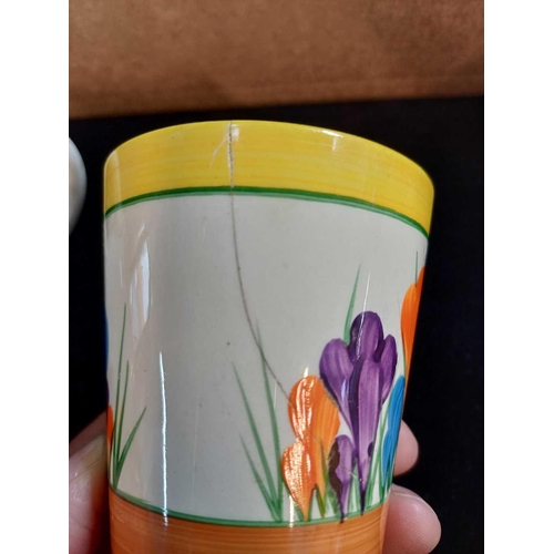 610 - Clarice Cliff Crocus pattern. Comprising: two teacups, two breakfast cups, a mug, an egg cup, four s... 