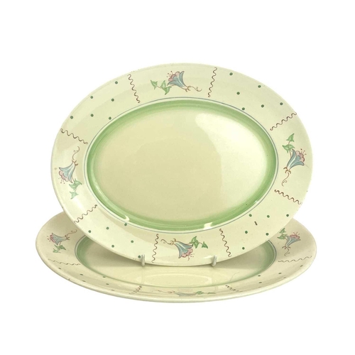 639 - A Clarice Cliff Honeyglaze part service. Comprising: four dinner plates and two graduating oval plat... 