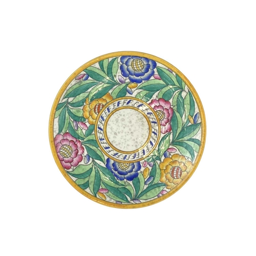 652 - A Charlotte Rhead for Crown Ducal charger. Decorated with bright coloured flowers and foliage, diame... 