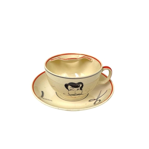 659 - A Rare Susie Cooper left hand Moustache cup and saucer. Susie Cooper Production Burslem marks togeth... 