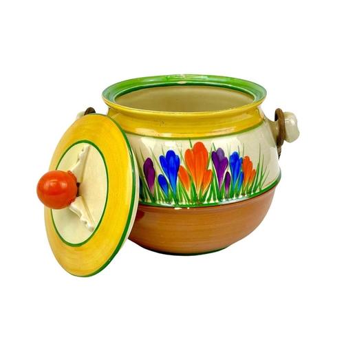 666 - A Clarice Cliff Crocus pattern 335 shape biscuit barrel. Bizarre Wilkinson Ltd marks, height 15cm.