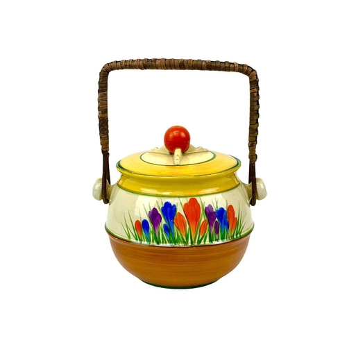 666 - A Clarice Cliff Crocus pattern 335 shape biscuit barrel. Bizarre Wilkinson Ltd marks, height 15cm.