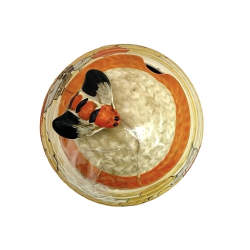 668 - A Clarice Cliff Carpri pattern beehive honey pot and cover. Bizarre Wilkinson Ltd marks, height 7cm.