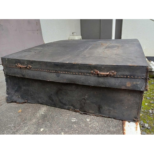 67 - An early to mid-19th-century trunk in leather-covered wood 121x69cm and 25cm deep. The base concave.