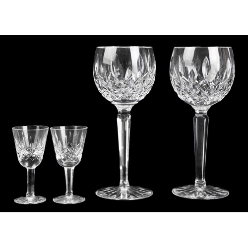 695 - A Waterford Crystal part suite. Lismore pattern comprising: six hock, five claret, five champagne fl... 