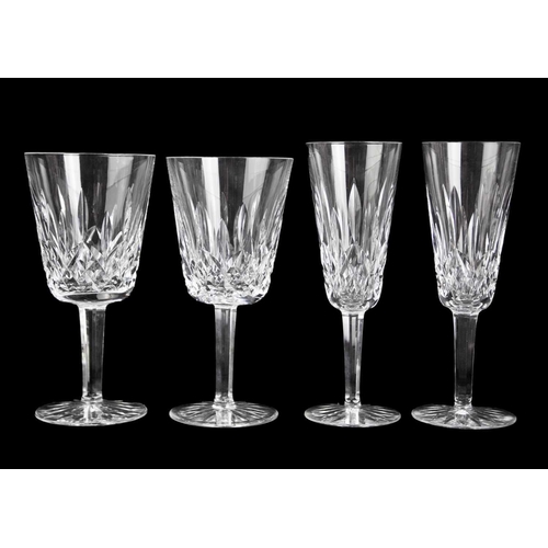 695 - A Waterford Crystal part suite. Lismore pattern comprising: six hock, five claret, five champagne fl... 