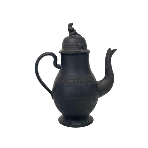 720 - A black basalt baluster coffee pot and cover. Circa 1800, possibly Elijah Mayer, with widow knop, an... 