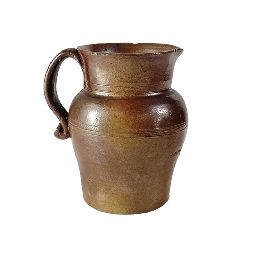 729 - An 18th century brown salt glaze jug. Height 12.5cm, together with a larger and later polychrome sal... 