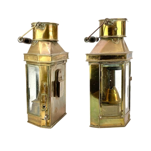 73 - A pair of brass bulkhead oil lamps by Bulpitt & Sons. Height 40cm. (2)