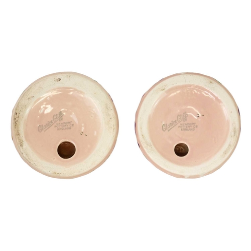 732 - A pair of Clarice Cliff My Garden pattern candleholders. Newport Pottery Co marks, diameter 9cm. (2)