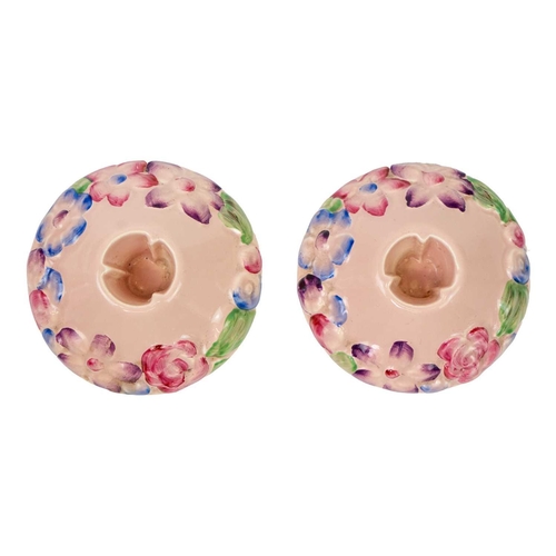 732 - A pair of Clarice Cliff My Garden pattern candleholders. Newport Pottery Co marks, diameter 9cm. (2)