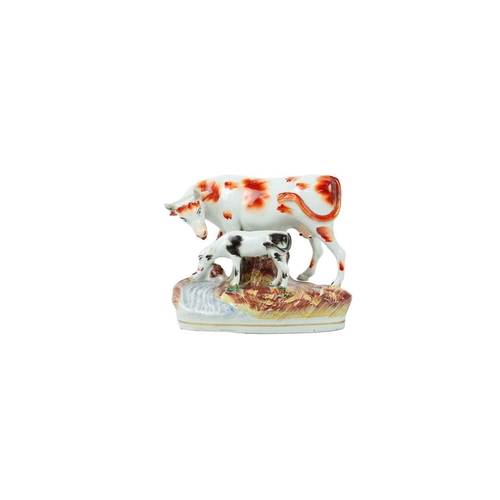 735 - A Victorian Staffordshire horse and foal spill vase. Height 32cm, together with other Staffordshire ... 