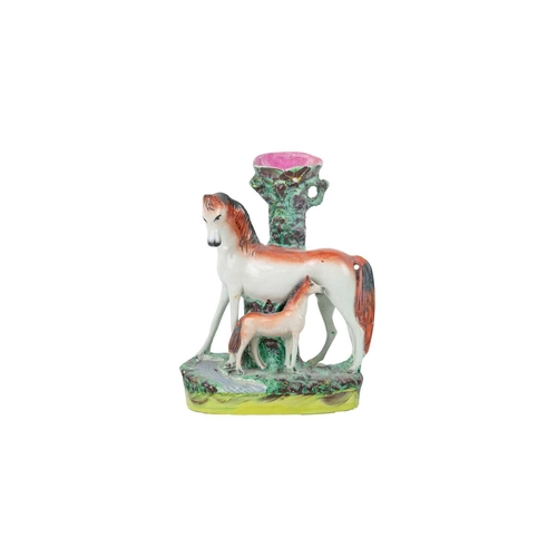 735 - A Victorian Staffordshire horse and foal spill vase. Height 32cm, together with other Staffordshire ... 