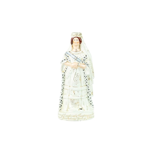 736 - A Staffordshire pottery figure of Queen Victoria. Titled to the base, commemorating the Golden Jubil... 