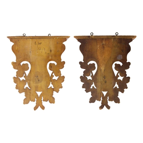 75 - A pair of Black Forest linden wood wall brackets. Late 19th century, each carved with a stag head an... 