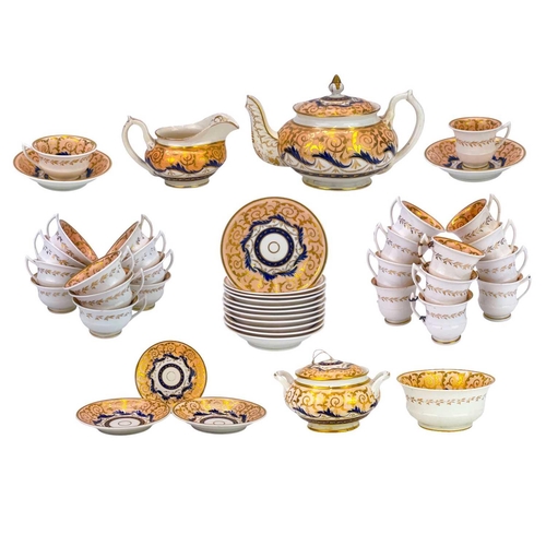 756 - An English porcelain tea and coffee set. Circa 1840, with salmon pink, blue and gilt decoration, com... 