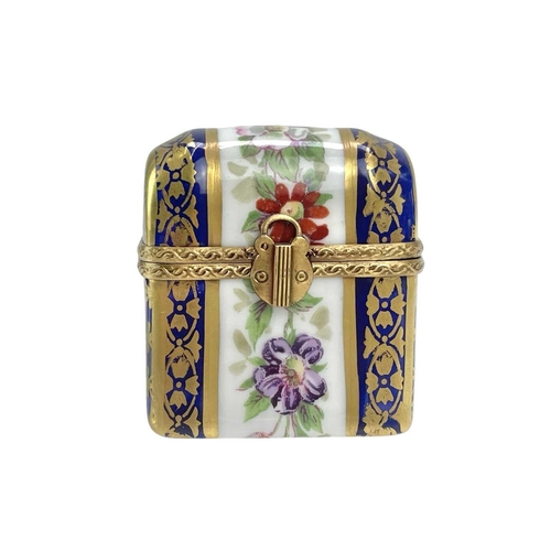 772 - Three Limoges porcelain trinket boxes. Each with painted floral decoration, largest height 6.5cm. (3... 