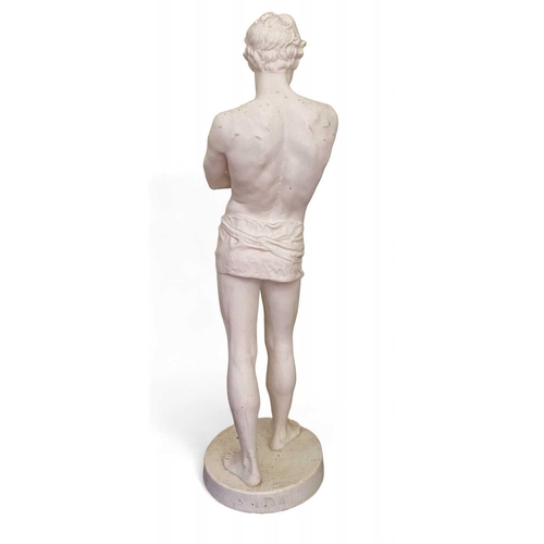 773 - A Gustavsberg Parian figure of a Classical male. Standing, with arms folded, wearing a loin cloth, o... 