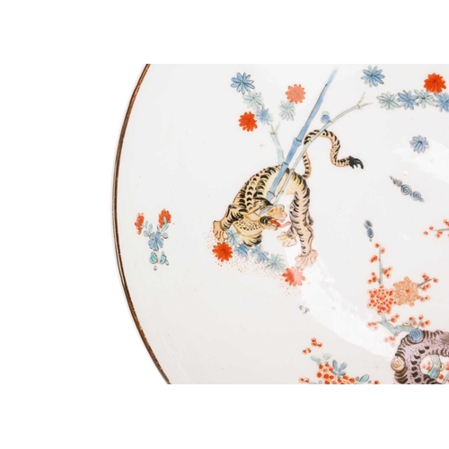 774 - A Meissen porcelain shallow bowl. 18th century, painted in the Kakiemon palette with a 'Gelber Lowe'... 