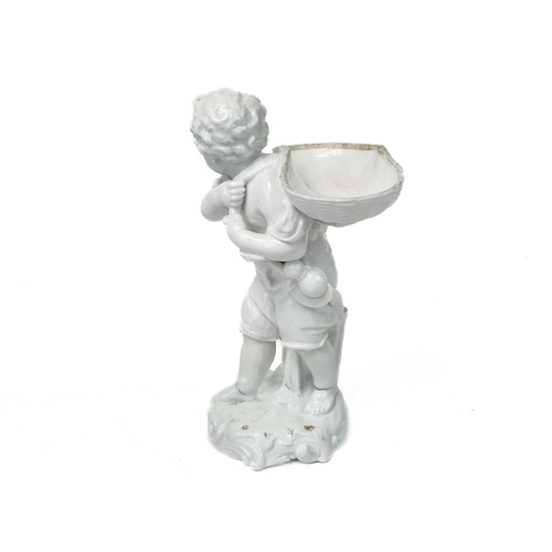 777 - A Dresden white glazed figure of a boy with a basket. 19th century, with a scythe and bottle at his ... 