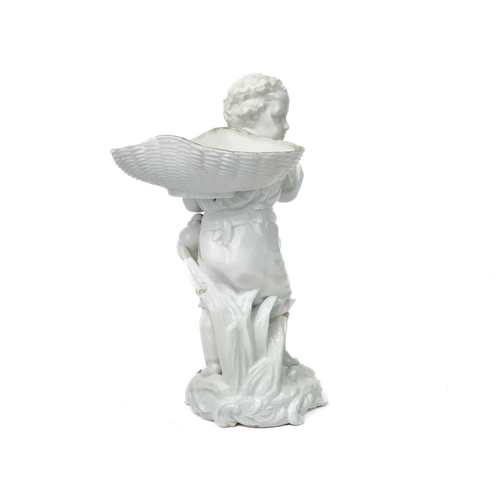 777 - A Dresden white glazed figure of a boy with a basket. 19th century, with a scythe and bottle at his ... 