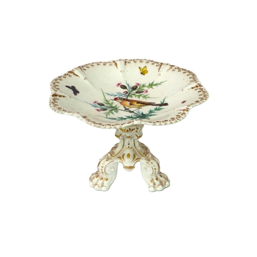 778 - An ornate Victorian bone china comport. Painted with a goldfinch amidst thistles, with butterflies a... 