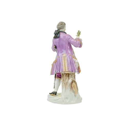 784 - A Meissen figure of a Gallant with a sword.. Late 19th century, in 18th century costume, height 20cm... 