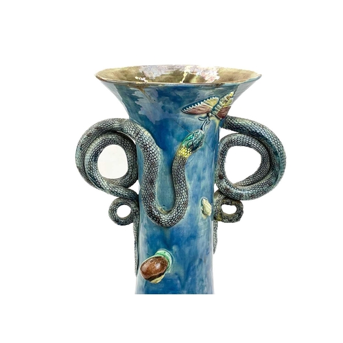 795 - A Portugese Palissy style vase. Circa 1900, with curled snake handles and applied moulded foliage, l... 