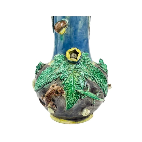 795 - A Portugese Palissy style vase. Circa 1900, with curled snake handles and applied moulded foliage, l... 