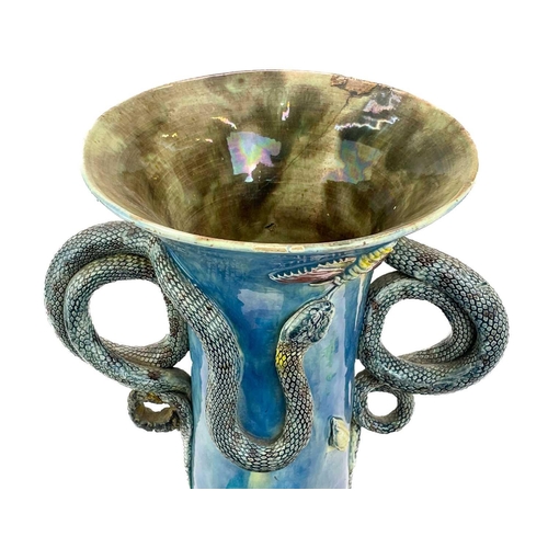 795 - A Portugese Palissy style vase. Circa 1900, with curled snake handles and applied moulded foliage, l... 