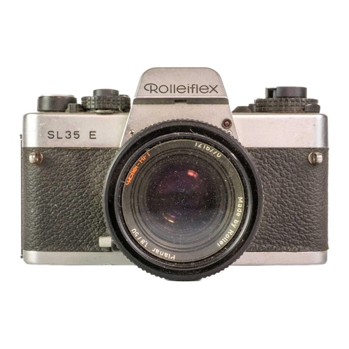 80 - A Rolleiflex SL35 E camera. Fitted with a Rollei-HFT Planar 1,8/50 lens together with a Zeiss Ikon N... 