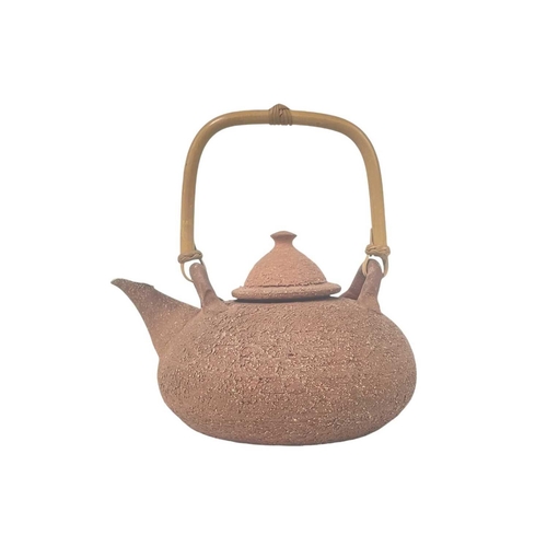 801 - Two studio pottery teapots and covers. One inscribed Lecomte henton?, with a bamboo handle, the othe... 