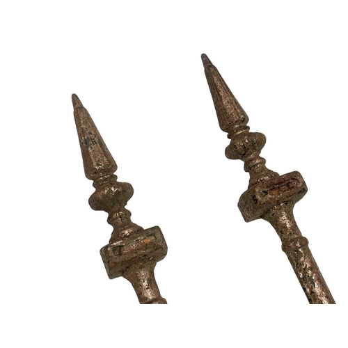 805 - A pair of cast iron railing finials. Height 87cm.