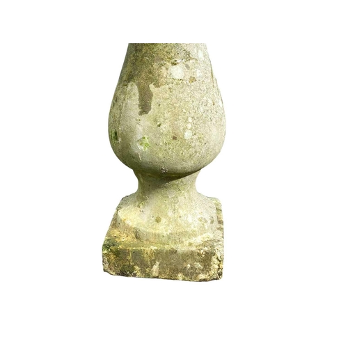 820 - A reconstituted stone bird bath. Raised on a baluster column, height 63cm.