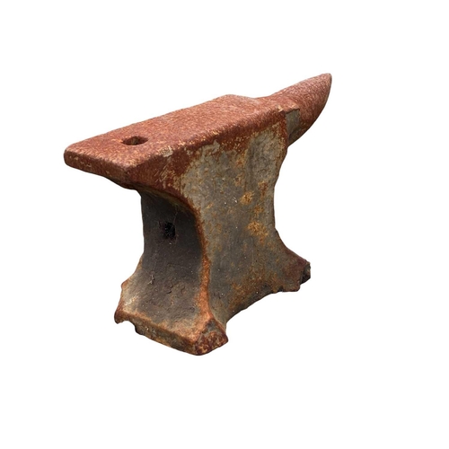 823 - A small cast iron blacksmith's anvil. Height 21cm.