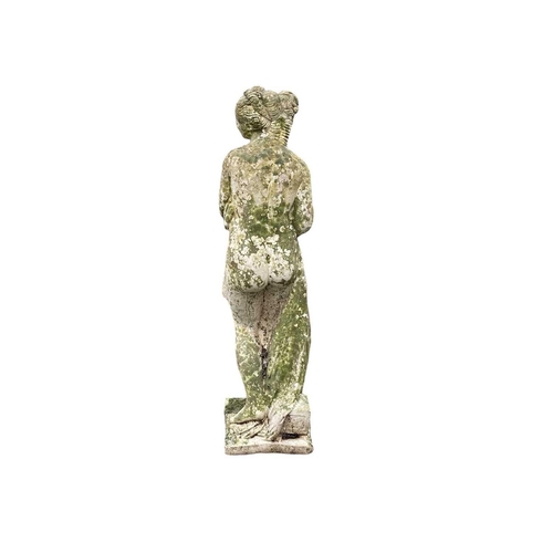 824 - A reconstituted stone emblematic figure of winter. Height 80cm.