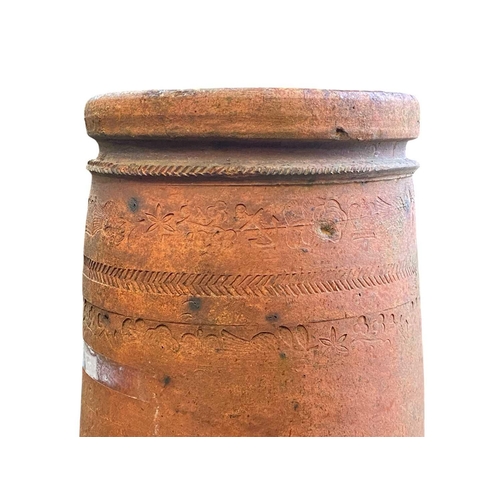 827 - An early to mid 18th century terracotta chimney pot. With banded repeat impressed Union decoration o... 