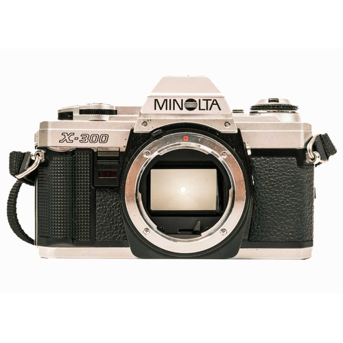 88 - A collection of cameras and accessories. Including a Nikon EM, a Minolta X-300, a Yashica TLR roll f... 